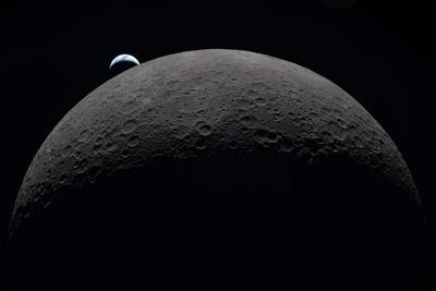 Earthrise over the lunar horizon, close view